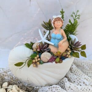 Kagyló formájú kaspóban készült nyári dekoráció